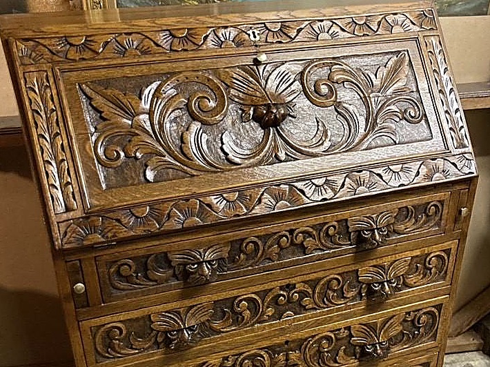 Hand-carved acanthus detail on a restored oak bureau